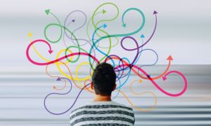 multitasking man looking at different colored arrows